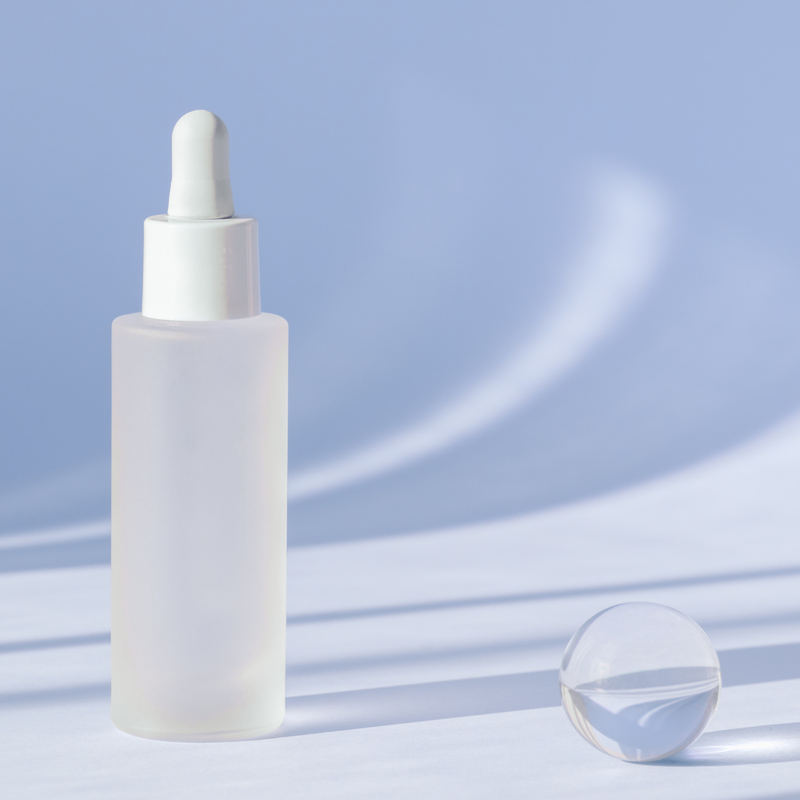 What are the benefits of using frosted glass for serums and creams?