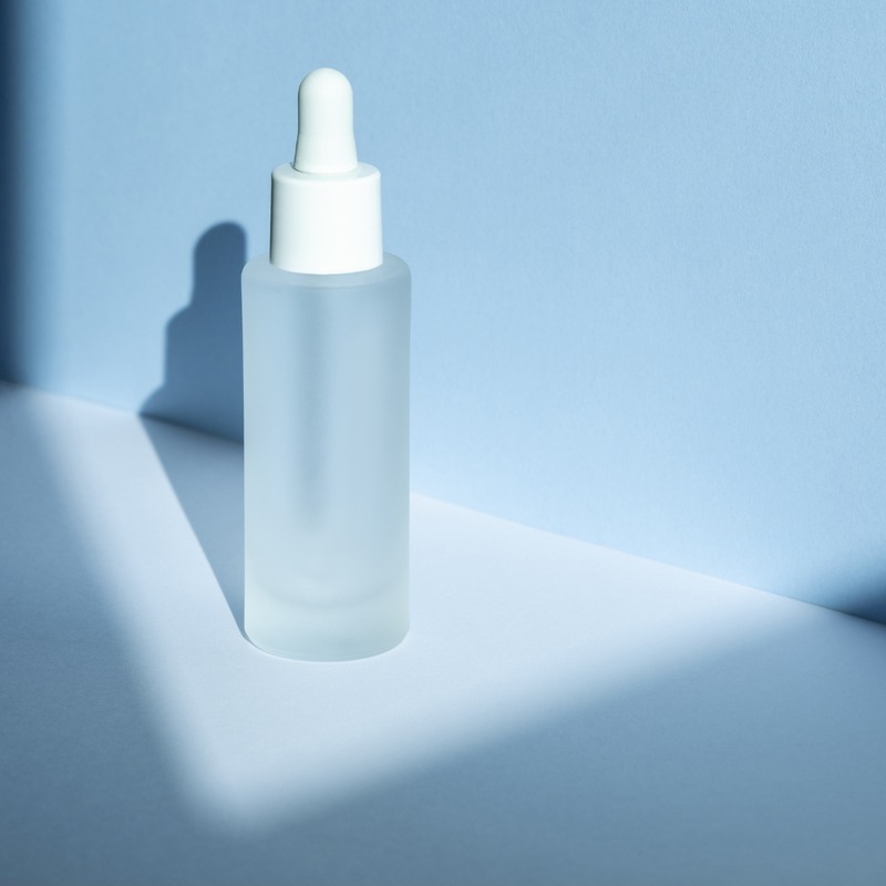 Why is frosted glass bottles used in cosmetic packaging?