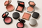 Why do some blush compacts have a magnetic closure?