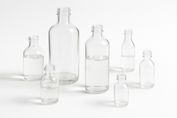 Can UV light damage cosmetics in clear glass bottles?