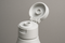 How does a flip top bottle cap work?