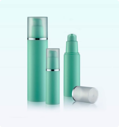 Three teal airless pump bottles with brushed-silver collars